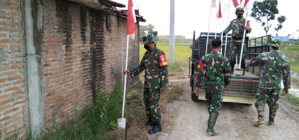 Semarak Merah putih Sepanjang Jalan Desa Tamansari Sambut Upacara Pembukaan TMMD